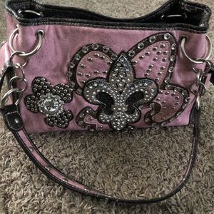 Blinged out New Orlean Saints leather purse.